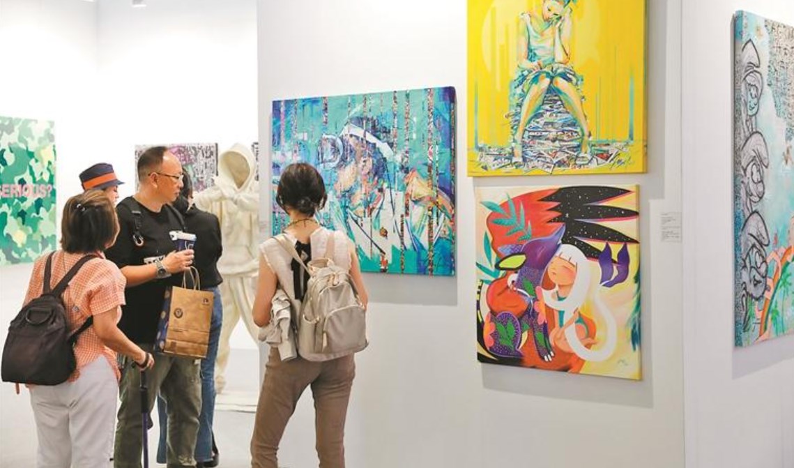 ��˫չ��ͬ�������ڻ�չ���ľٰ�